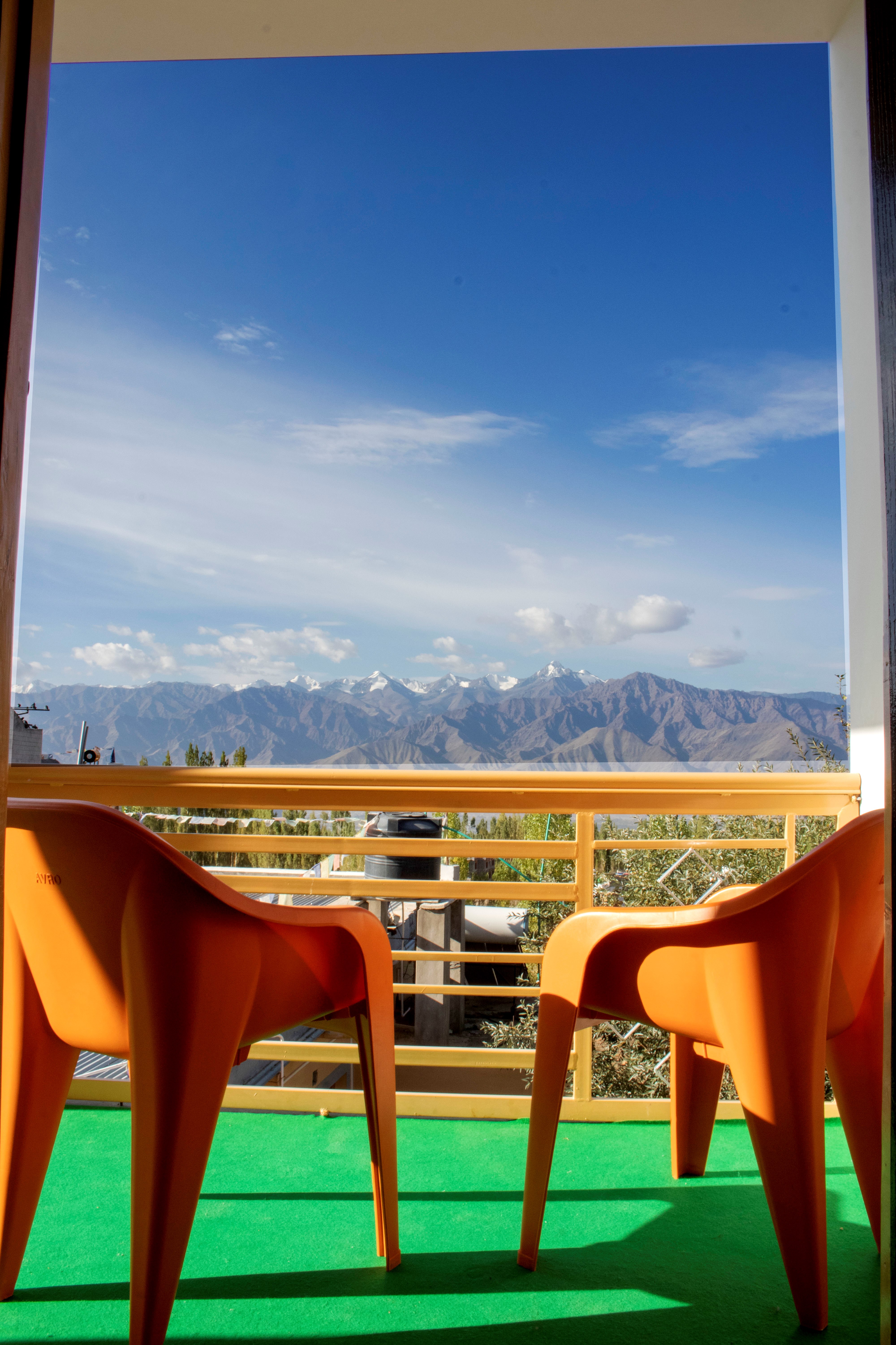 Luxury outdoor seating area at Leh Town Residency with breathtaking Himalayan views